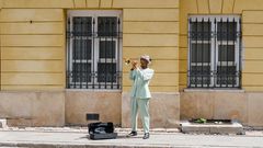 Man playing the trumpet in the street [Image: Mart Production]