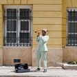Man playing the trumpet in the street [Image: Mart Production]