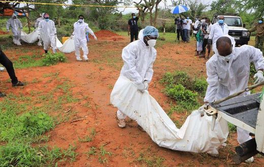Forensic experts and homicide detectives carry the bodies of suspected members of Good News International Church after their remains were exhumed from graves in Shakahola forest Kilifi County on April 22, 2023. [Photo: Reuters]