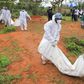 Forensic experts and homicide detectives carry the bodies of suspected members of Good News International Church after their remains were exhumed from graves in Shakahola forest Kilifi County on April 22, 2023. [Photo: Reuters]