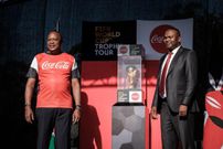 Former President Uhuru Kenyatta (L) and Former CS for Sports and Heritage Rashid Achersa pose with the FIFA World Cup Trophy during its World Tour at the State House in Nairobi on February 26, 2018. (Photo by YASUYOSHI CHIBA/AFP via Getty Images)