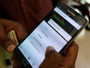 A person using M-PESA