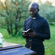 A pastor conducting a funeral