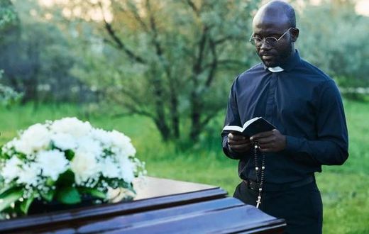 A pastor conducting a funeral