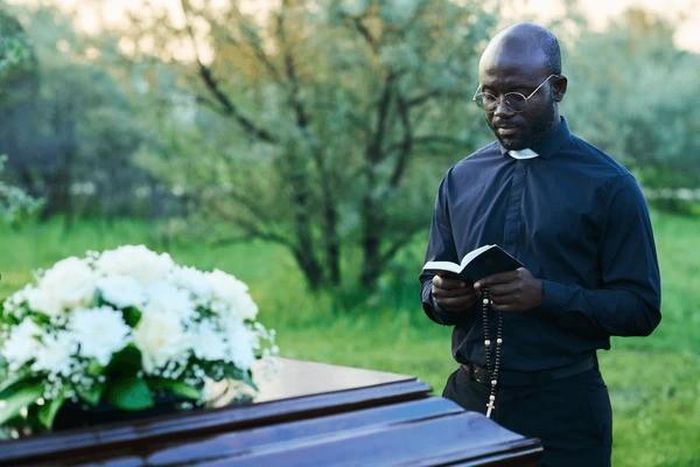 A pastor conducting a funeral