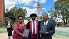 Moses Wetangula with son after being conferred with PhD