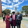 Moses Wetangula with son after being conferred with PhD