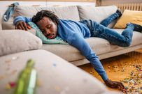 A man sleeping on a couch