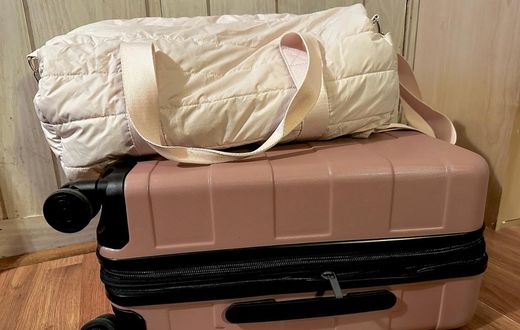 I recently ditched this duffel bag in favor of the pink roller suitcase beneath it.Amanda Krause/Insider
