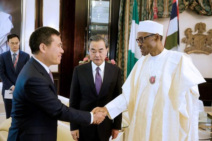 Nigeria’s President Muhammadu Buhari greets China’s Foreign Minister Wang Yi (C) and Chinese Ambassador to Nigeria Zhou Pingjian during their visit to the Presidential Villa in Abuja, Nigeria [REUTERS]