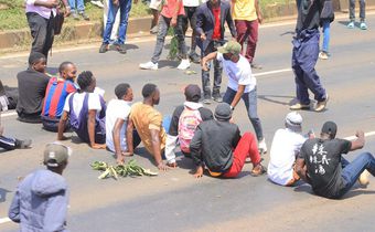 Protesters stage a sit-in along Thika Road demanding justice for the late Denzel Omondi who disappeared on June 25 and his body was later discovered in a Juja quarry [Image Credit: Tobiko Abraham]