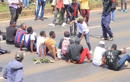 Protesters stage a sit-in along Thika Road demanding justice for the late Denzel Omondi who disappeared on June 25 and his body was later discovered in a Juja quarry [Image Credit: Tobiko Abraham]