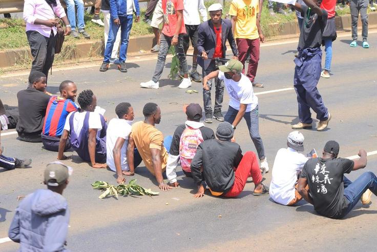Protesters stage a sit-in along Thika Road demanding justice for the late Denzel Omondi who disappeared on June 25 and his body was later discovered in a Juja quarry [Image Credit: Tobiko Abraham]