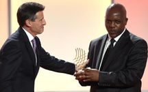 Elias Makori receiving the 2012 IAAF World Journalist of the Year Award from Seb Coe in 2012. His longevity in the profession culminated in him winning the award, a feat he attained for his impeccable reporting. PHOTO/Courtesy/Elias Makori