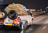 Screenshots of a video showing a race between a Toyota FJ Cruiser and two miraa vehicles along Thika Superhighway