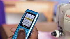 A Kenyan using their phone