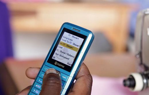 A Kenyan using their phone