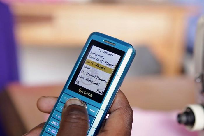 A Kenyan using their phone