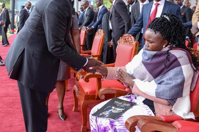 President William Ruto with Kelvin Kiptum's widow, Asenath Rotich during the marathon champion's funeral service in Chepkorio