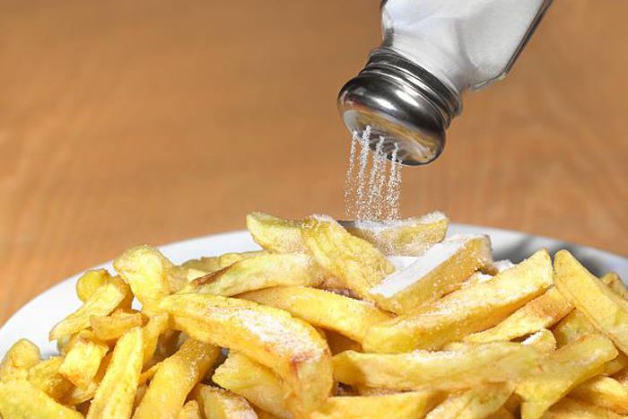 Sprinkling salt to food