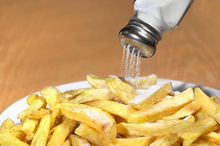 Sprinkling salt to food