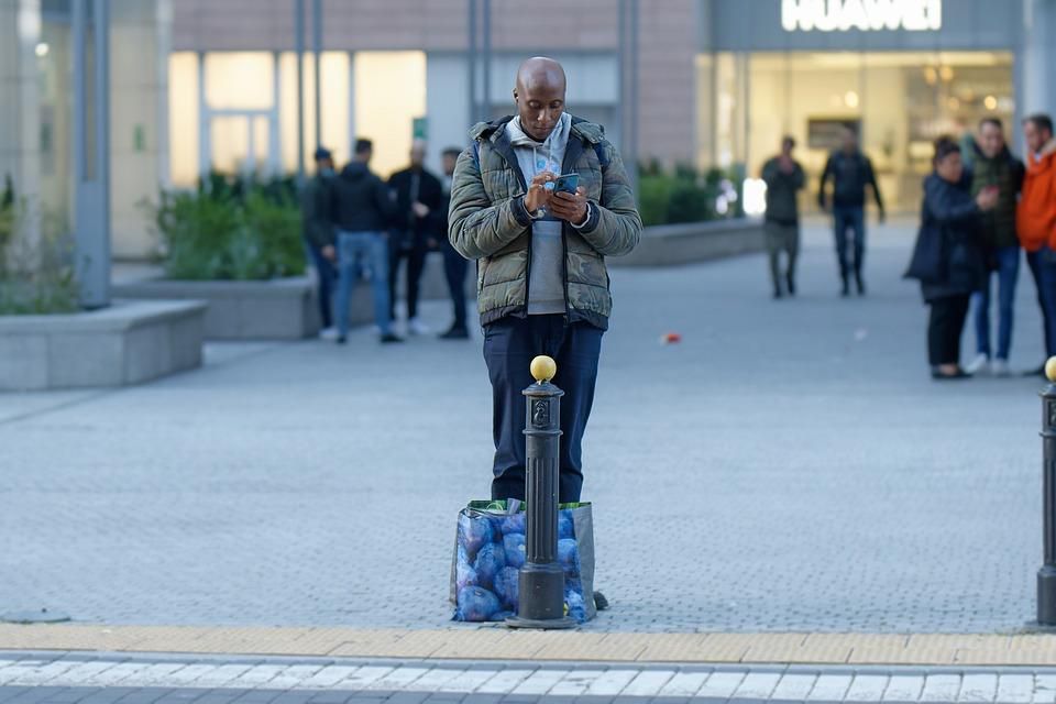 A man standing on the pavement