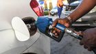 A pump attendant fills a car with fuel at the OlA petrol station, following country wide price hikes on March 15, 2022, in Nairobi. (Photo by SIMON MAINA/AFP via Getty Images)