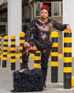 Eric Omondi in a hair suit
