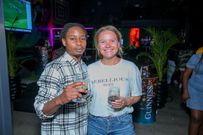 Popular musician Chris Kaiga and Guinness Marketing Manager HenriettaReed(right) pose for a photo during the Guinness brightest matchday made by thefans at Bar Next Door, Kiambu Road