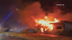 A photo of a building on fire