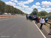 Kenyans gather along Eastern Bypass which borders Kenyatta family farm, Northlands