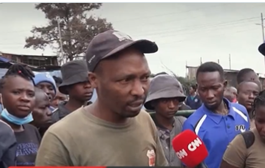 Larry Madowo comes to the aid of a man during maandamano on July 20 in Kamukunji area, Nairobi