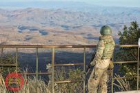 Security officer scans the expansive area inhabited by bandits