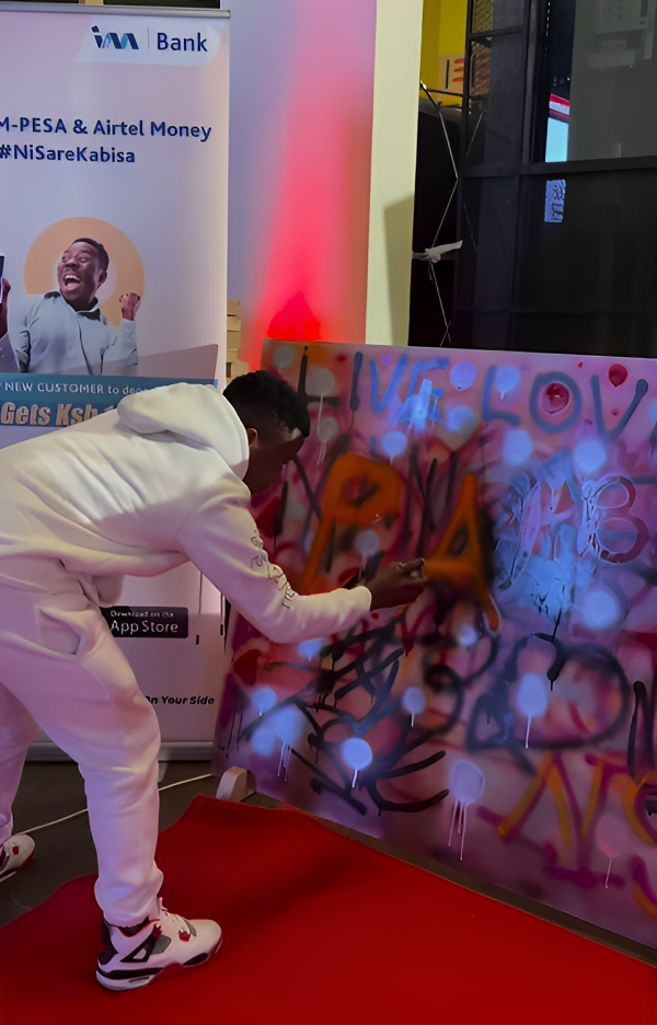 Guest participating in Kenya's most collaborative art piece, sponsored by I&M Bank at the Pulse Influencer Awards 2023