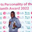 Sarah Achieng poses with her trophy/HANDOUT