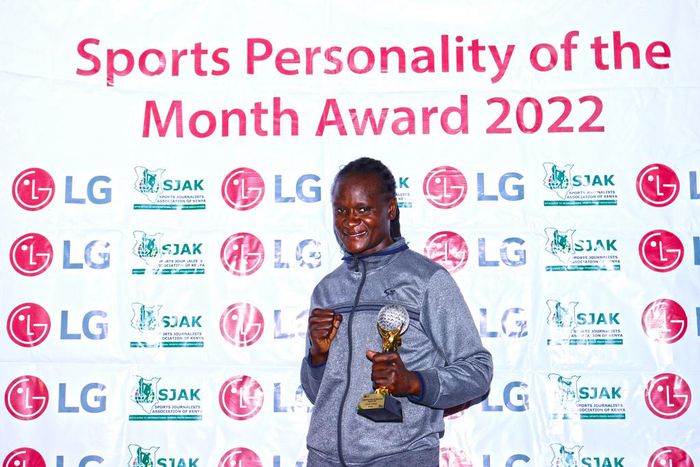 Sarah Achieng poses with her trophy/HANDOUT