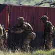Soldiers take up position as they take part in a simulated military exercise of the British Army Training Unit in Kenya (BATUK) together with the Kenya Defence Forces (KDF) at the ol-Daiga ranch, high on Kenya's Laikipia plateau on March 27, 2018. (TON...