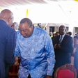 Retired President Uhuru Kenyatta greets CS Moses Kuria during the Episcopal Ordination for Bishops elect Simon Peter Kamomoe and Wallace Ng'ang'a at St Mary's Msongari.