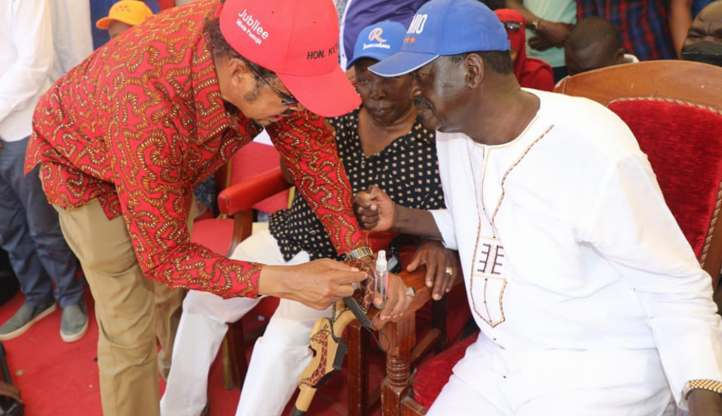 Azimio La Umoja presidential aspirant Raila Odinga with Dr Adan Keynan during a campaign rally in Wajir County on March 9, 2022