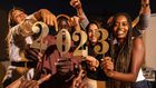 A group of happy friends celebrating New Year together