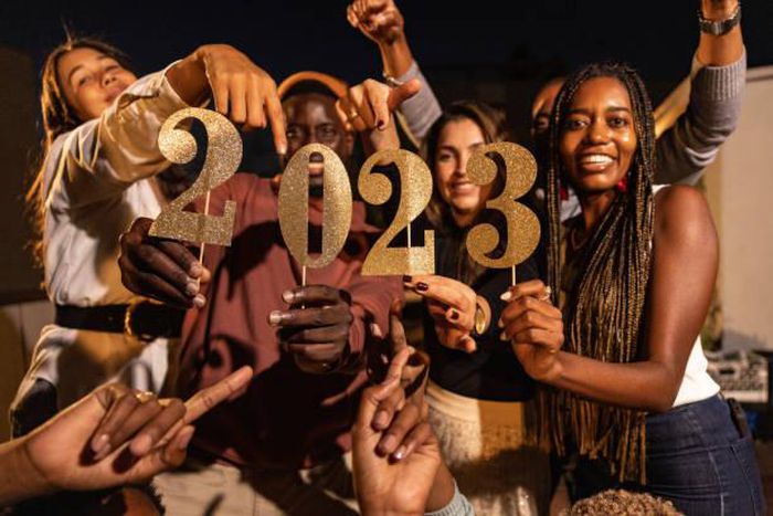 A group of happy friends celebrating New Year together