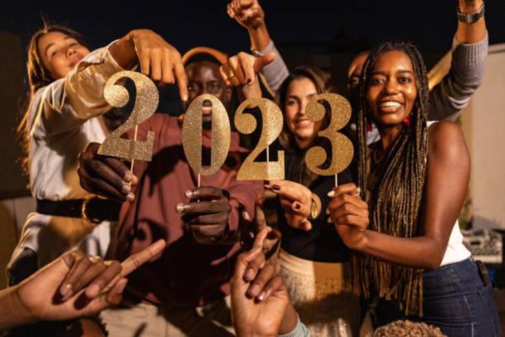 A group of happy friends celebrating New Year together