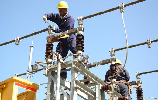 A Kenya Power worker on site