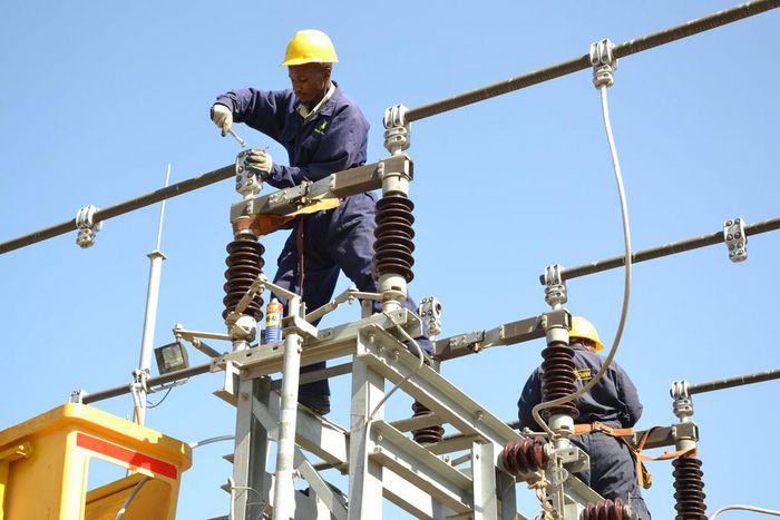 A Kenya Power worker on site