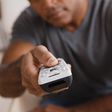 A man holding a remote control