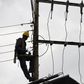 [FILE] Kenya Power and Lighting Company (KPLC) live line experts dismantle power cables to relocate power lines to pave way for the construction of the Nairobi Expressway in Westlands, Nairobi, on September 24, 2020. (Photo by SIMON MAINA/AFP via Getty...