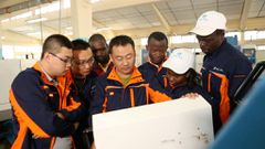 A Chinese trainer gives instructions to an ATC participants