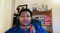 File image of Narok Senator Ledama Olekina attending a virtual Senate session in traditional attire