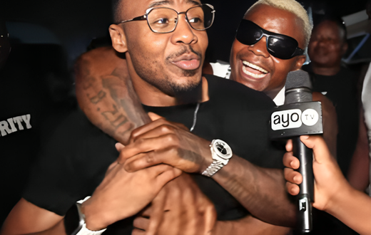 Harmonize (back) hugging Alikiba
