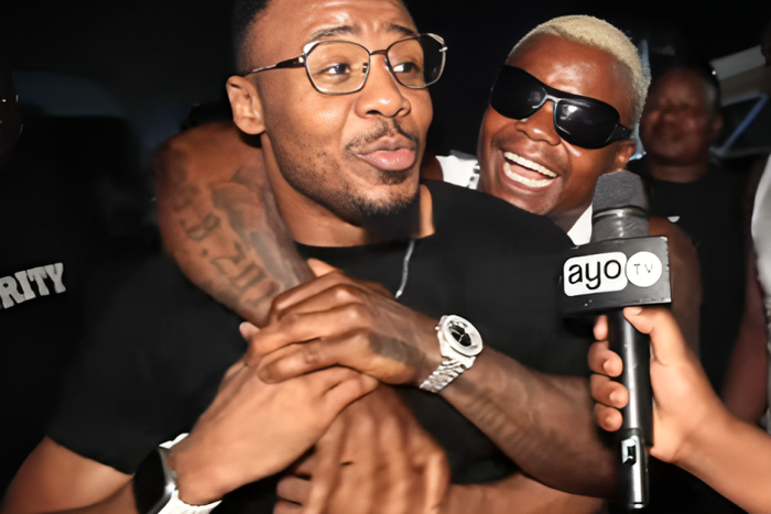 Harmonize (back) hugging Alikiba